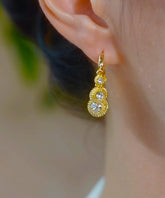 Pendientes de aro de durian con circonitas y aleación de cobre y oro de moda